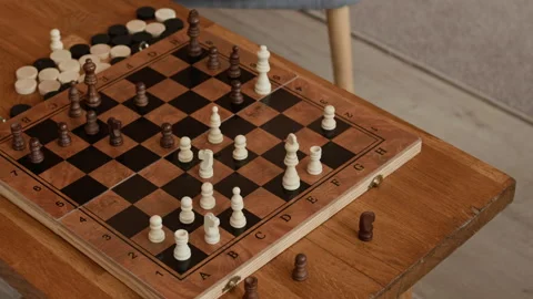 Minimalist Black and White Small Chess Pieces on Board on Wooden Table Stock Footage 333185993