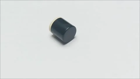 Minimalist Black Cylindrical Perfume Bottle Cap Close Up Stock-Footage 336472936