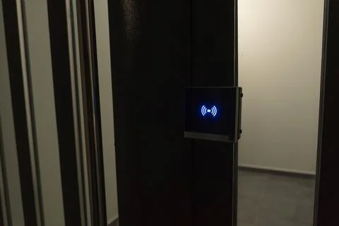 A minimalist close-up of a digital electronic smart lock featuring a glowing  Stock Photos