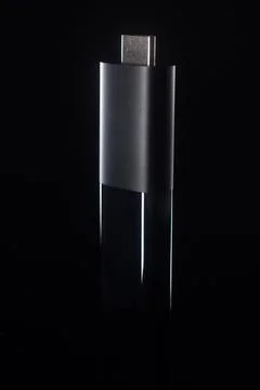 Minimalist Close-Up of USB-C Streaming Stick on Black Background Stock Photos