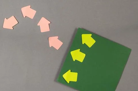 Minimalist composition with square sheets of paper and bookmark arrows. Gray  Stock Photos