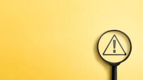 A minimalist conceptual image featuring a black magnifying glass focusing o.. Stock Photos