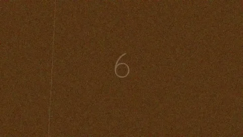 Minimalist countdown graphic with white numeral nine on dark brown background Stock Footage 342206454