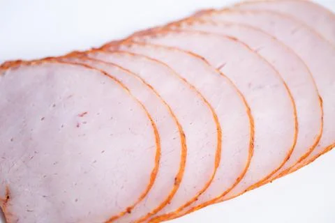 Minimalist culinary stock image of ham slices, isolated composition on white  Foto stock