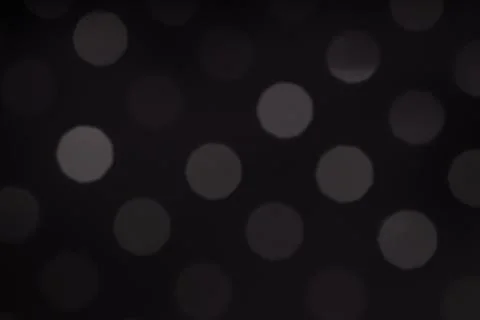 Minimalist dark abstract background featuring soft grey bokeh circles in a Stock Photos