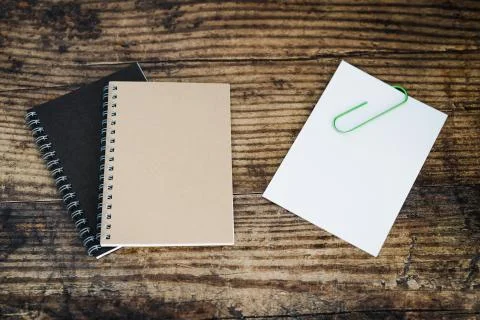 Minimalist desk setting flatlay with notepads  and memo with clip Stock Photos