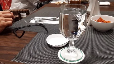 Minimalist Dinner Table Layout With Wineglass Water Ceramic Utensils On Wooden Stock Footage 317944183