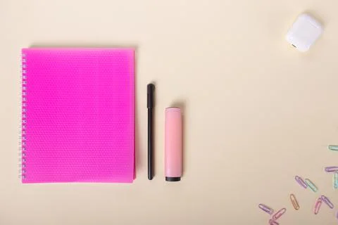 Minimalist flat lay layout with school notebook on a beige background Stock Photos
