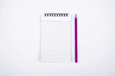 Minimalist Flat Lay of Open Notebook and Pencil Isolated on White Surface Stock Photos