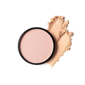 Minimalist flatlay of a makeup compact with crushed powder on a white backgro Stock Photos