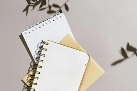 Minimalist flatlay with various notebooks on grey background Stock Photos