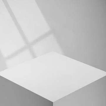Minimalist gray podium stand with soft window frame shadow on a textured wall Stock Photos