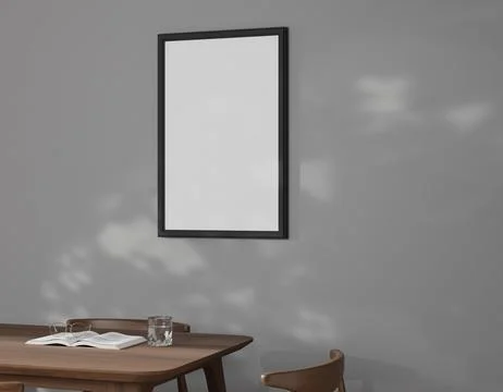 A minimalist gray room features a blank framed poster on a wall Stock-Illustration