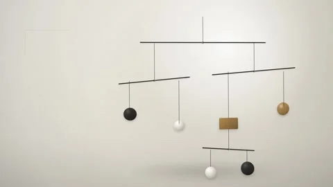 A minimalist hanging mobile sculpture featuring simple geometric shapes inc.. Stock Footage 346723370