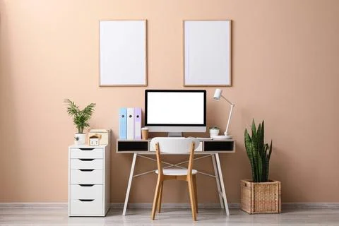 Minimalist home office workspace with computer and plants Stock Photos