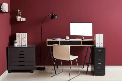 Minimalist home office workspace with computer and chair Stock Photos