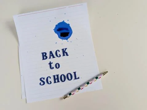 Minimalist horizontal back to school concept featuring dark blue fabric letter Stock Photos