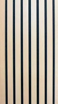 Minimalist interior background featuring two shades of wooden acoustic slat.. Stock Photos