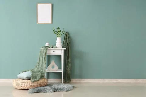 Minimalist interior with white side table and decorative elements Stock Photos