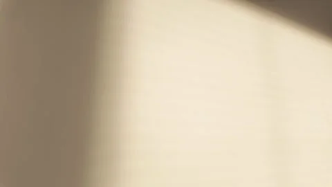 Minimalist Light and Shadow Play on Neutral Wall Stock Footage 263927879