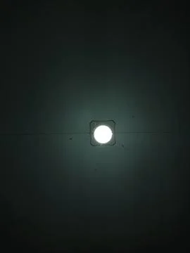 Minimalist Light Source in Dark Interior Stock Photos