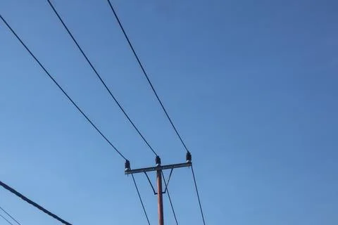 Minimalist Low Angle View of Overhead Power Lines and Utility Pole Against C Photos