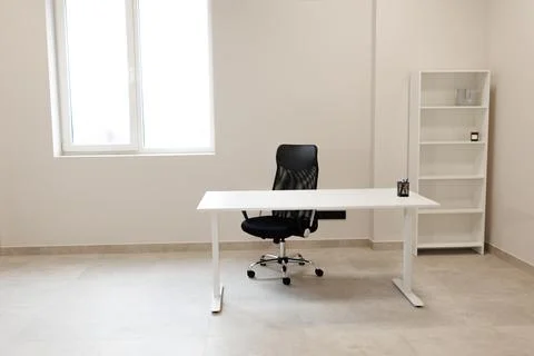 Minimalist modern interior design. Empty office room with white walls and win Stock Photos