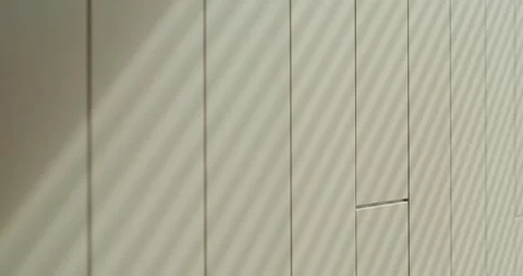 Minimalist Modern Wall Design with Vertical Lines and Shadow Stock Footage 342803935