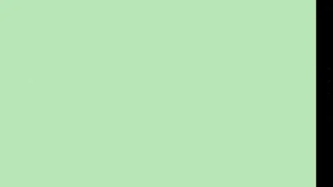 Minimalist pastel green backdrop featuring smooth solid surface texture with 스톡 동영상 346040734