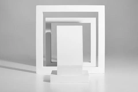 Minimalist podium design of square platforms and frames on gray background Illustrazione stock