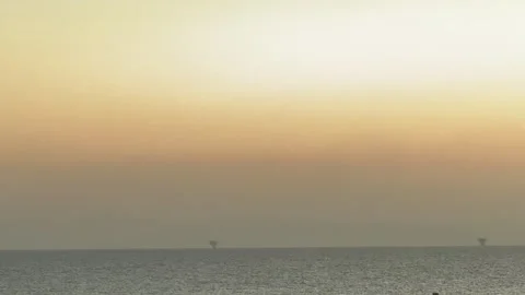 Minimalist Red Sea Horizon &amp; Distant Offshore Rigs at Sunset Stock Footage 337376433