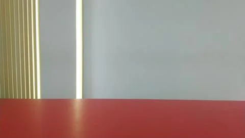 Minimalist Red Surface with Abstract Vertical Lines and Light. Stock Photos