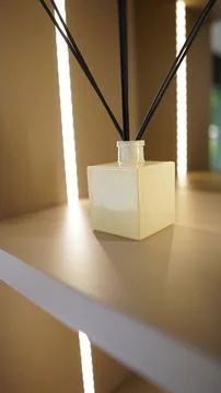 Minimalist Reed Diffuser Bottle on Shelf with Soft Light Stock Photos