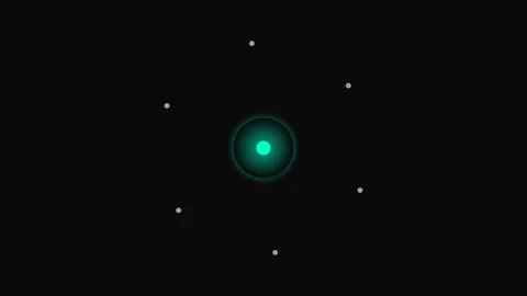 A minimalist representation of a glowing atom against a deep black background Stock Footage 339615611
