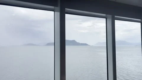 Minimalist Ship Window View with Blue Sea and Distant Fjords Stock Footage 340108631