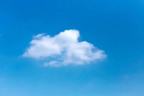 Minimalist Single White Cloud Formation Against Clear Blue Sky Backdrop Stock Photos
