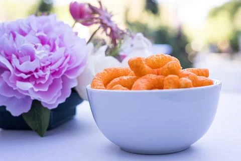 Minimalist Snack Table Setup with Cheese Puffs Stock Photos