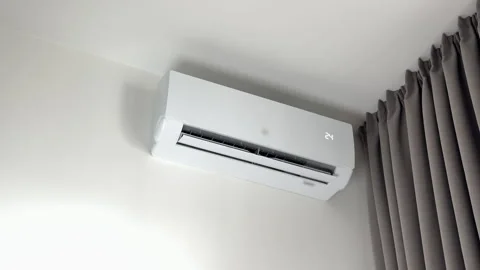 Minimalist split system conditioning unit working reliably on a plain white.. Stock Footage 346156348