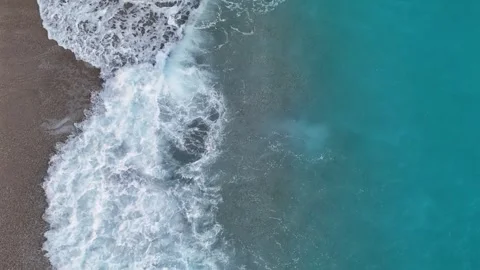 Minimalist Split View of Turquoise Sea and Sandy Shore 4K Stock Footage 315507744