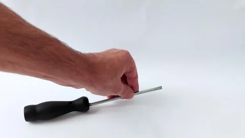 Minimalist Tool Interaction: Hand and Screwdriver on White Surface 스톡 동영상 318134540