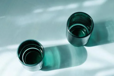 Minimalist Transparent Drinkware Casting Shadows Stock Photos