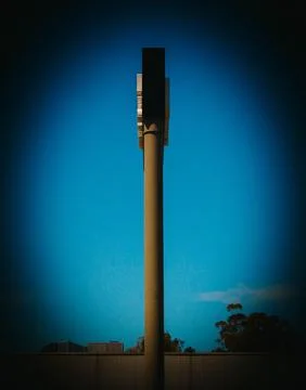 Minimalist Vertical Column Structure Against A Deep Blue Sky At Sunset Stock Photos