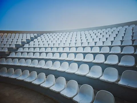 Minimalist view of empty white seats in modern open-air amphitheater Stock-Fotos
