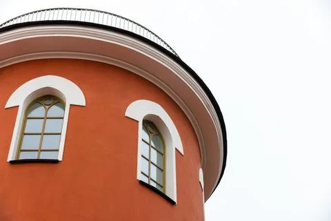Minimalist view of a red circular tower Stock Photos
