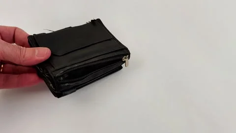 Minimalist Wallet Scene Featuring Worn Edges and Zipper Flap Stock Footage 321118408