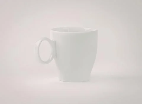Minimalist white ceramic coffee mug with handle Photos