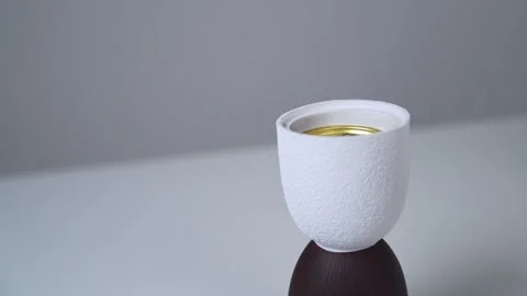 Minimalist white ceramic incense burner emitting smoke Stock Footage 336763979