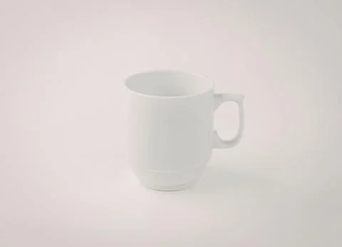 Minimalist white ceramic mug with handle Photos