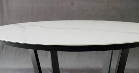 Minimalist White Dining Round Table on isolated gray background. White Table. Stock Footage 239417506