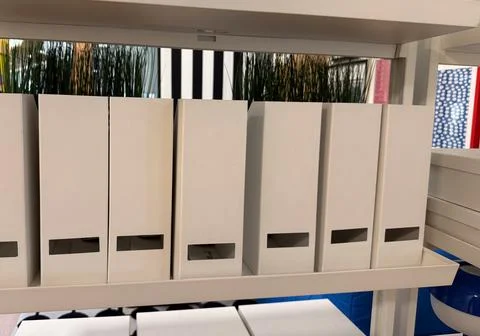 Minimalist white document boxes on a shelf for office or home organization co Foto stock